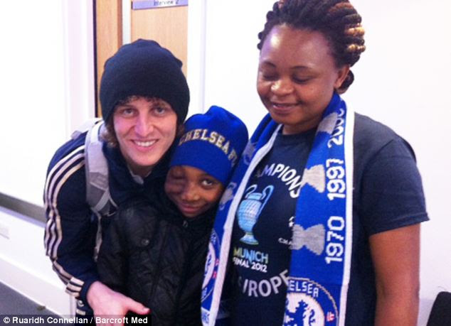 Triny Amuhirwe, 8, and her mother meeting David Luiz at Stamford Bridge
