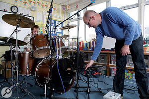 If you can't afford to hire a studio, close-miking and reverb is probably the best option for a roomy drum sound, but you could always try finding a local facility with a larger space — as here, when we used a local school hall! If you can't afford to hire a studio, close-miking and reverb is probably the best option for a roomy drum sound, but you could always try finding a local facility with a larger space — as here, when we used a local school hall!