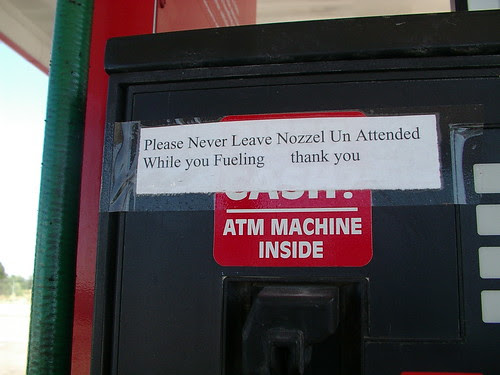 funny sign on gas pump