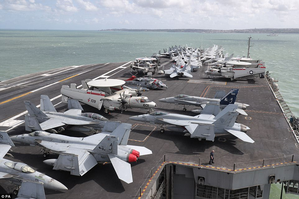 Planes on the flightdeck onboard the US Navy Nimitz-class aircraft carrier USS George H.W. Bush as it lays at anchor off the coastbefore it participates n Exercise Saxon Warrior 2017 in the Northern Atlantic Ocean