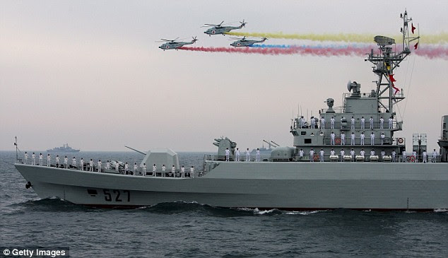 Military pomp: Chinese Navy helicopters and 527 warships attend the international fleet review on the 60th anniversary of the founding of the People's Liberation Army Navy