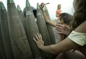 Israeli gilrs sign bombs destined to be dropped on Lebanon