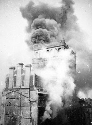 Warsaw Uprising: View of burning PAST-a buildi...