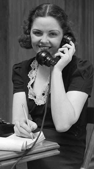 Woman Receptionist Secretary Sitting At Desk 