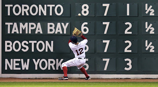 Brock Holt...Boston Red Sox left fielder Brock Holt (12) plays a double by Tampa Bay Rays designated hitter Corey Dickerson off the wall during fourth inning of a baseball game in Boston, Wednesday, April 20, 2016. (AP Photo/Charles Krupa)