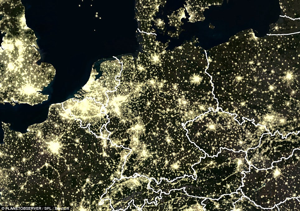 Glowing: The immense amount of light streaming up into the night sky from Britain and Europe can be seen here