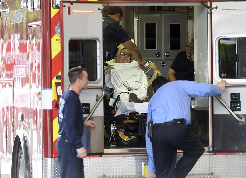 A shooting victim is seen in the back of an ambulance after arriving at the Broward Health Trauma Center on Friday