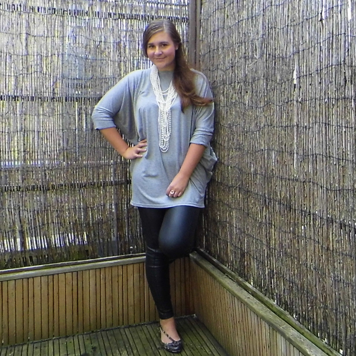 Leather trousers, slouchy top, big pearl necklace