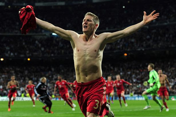 Bayern Munich's Bastian Schweinsteiger celebrates after scoring the final penalty against Real Madrid