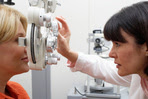 Woman getting eye exam 