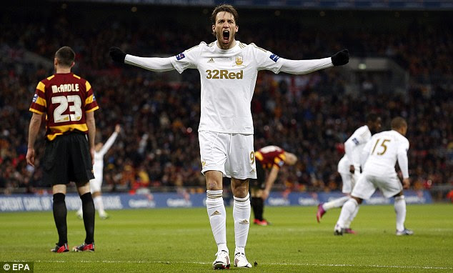 I'm the man! Michu celebrates his goal just before half-time