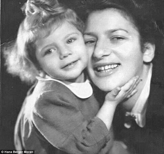 SS guards watched when Priska Lowenbeinova gave birth on a wooden plank laid across a table in the factory and placed bets on whether the baby would be a boy or a girl, pictured with daughter Hana