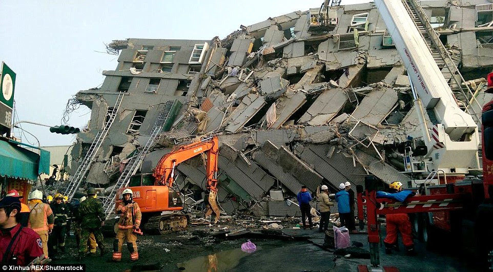 Rescuers work at the quake site in Kaohsiung, which was closer to the epicentre of the earthquake