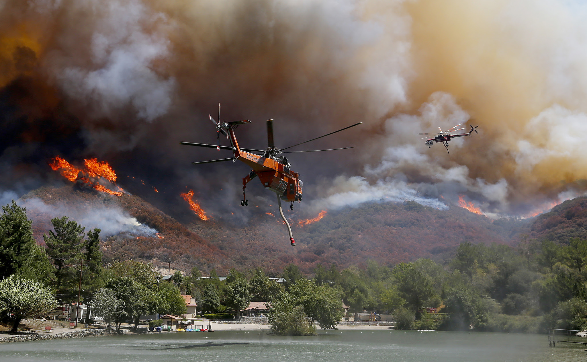 Firefighting helicopters battle the Blue Cut fire as it burns out of control around the community of Lytle Creek. (Luis Sinco / Los Angeles Times)