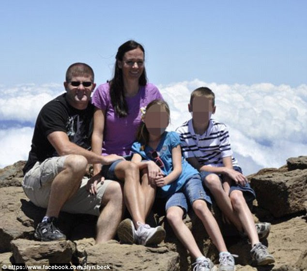 Family man: Alyn Beck (left) pictured last year with his wife and two children