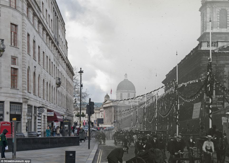 View of Duncannon Street in the City of London decorated with bunting and banners for the coronation ceremony of Edward VII. There are pedestrians and vehicles in the foreground and the National Gallery is visible in the distance
