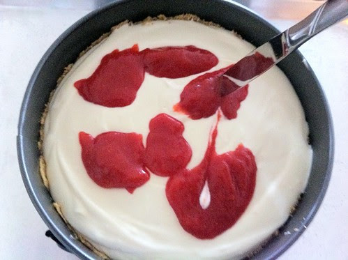Swirling Strawberry Curd into Cheesecake with Knife