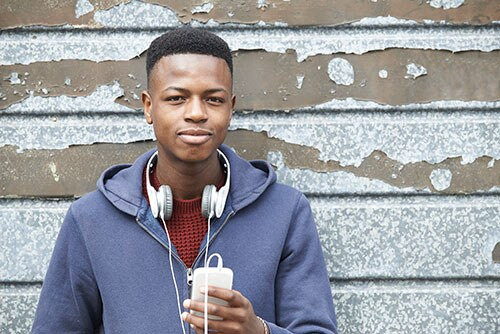  A young man listening to music on his headphones