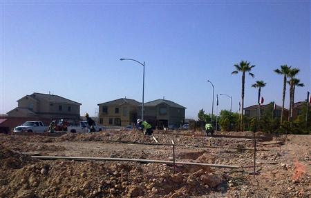 Workers prepare a plot of land in Las Vegas in May, 2012. REUTERS/Katya Wachtel