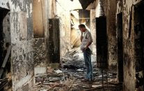 An employee of Doctors Without Borders, MSF, walks inside the charred remains of the organization's hospital after it was hit by a U.S. airstrike in Kunduz, Afghanistan. (AP/Najim Rahim)