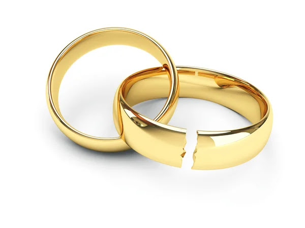 Broken gold wedding rings by Mikhail Solovev Stock Photo