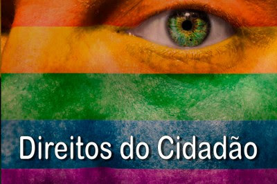 Imagem de um rosto, com destaque para o olho, com a bandeira LGBT sobreposta na imagem, com o letreiro descrito Direitos do Cidadao.