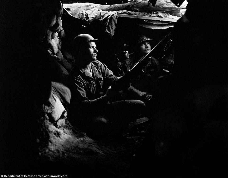 Infantrymen of the 27th Infantry Regiment, near Heartbreak Ridge, take advantage of cover and concealment in tunnel positions, 40 yards from the Communists on August 10, 1952. Peace talks began as early as July 1951, but it would take another two years until an armistice was signed on July 27, 1953