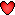 un petit coeur rouge
