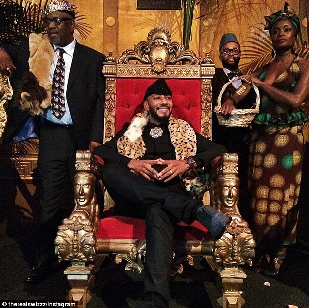 'My current vibe': The birthday boy sat on a gold and red velvet throne in the Coming To America-themed bash - the 1988 movie starring Eddie Murphy