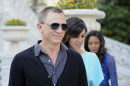 French actress Berenice Marlohe, center, British actor Daniel Craig and British actress Naomie Harris arrive for the photocall of the 23rd film in the James Bond series, 'Skyfall', in Istanbul, Turkey, Sunday, April 29, 2012.(AP Photo )