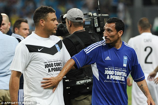 Have you lost weight? Argentinian Pablo Guinazu gets a grab of Ronaldo at the final whistle