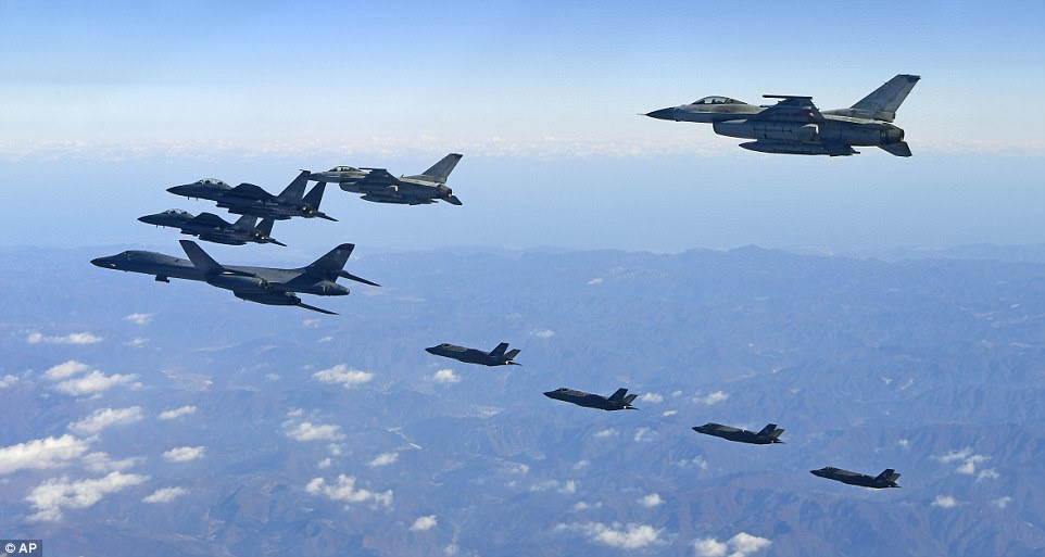 The United States flew a B-1B supersonic bomber (left) over South Korea on Wednesday in part of a massive combined aerial exercise involving hundreds of warplanes, a clear warning after North Korea last week tested its biggest and most powerful missile yet