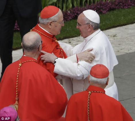 Pope Francis salutes cardinal Angelo Sodano, left, in St. Peter's Square 