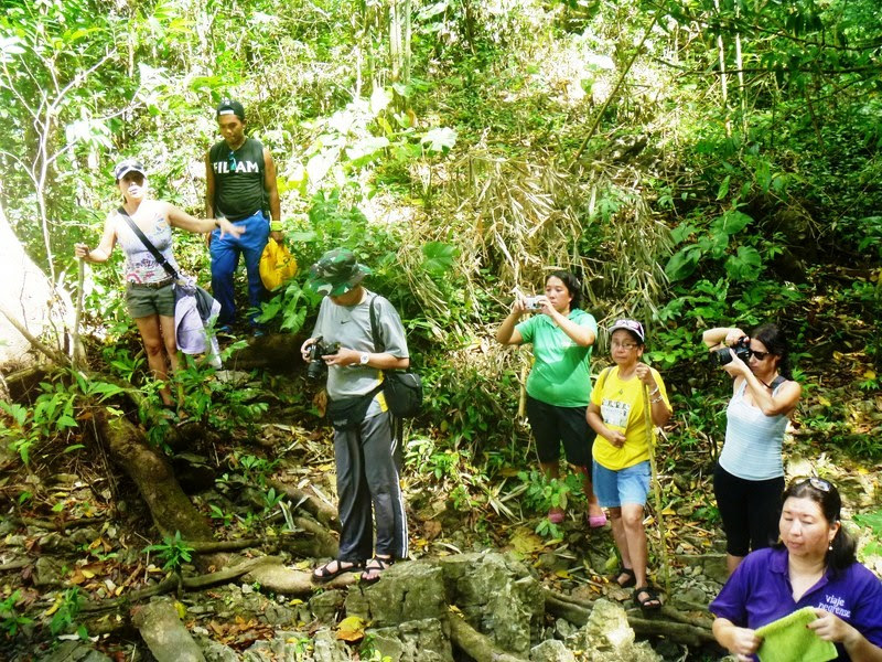 Gigi (left) leading trekkers to the Malumpati Head Spring