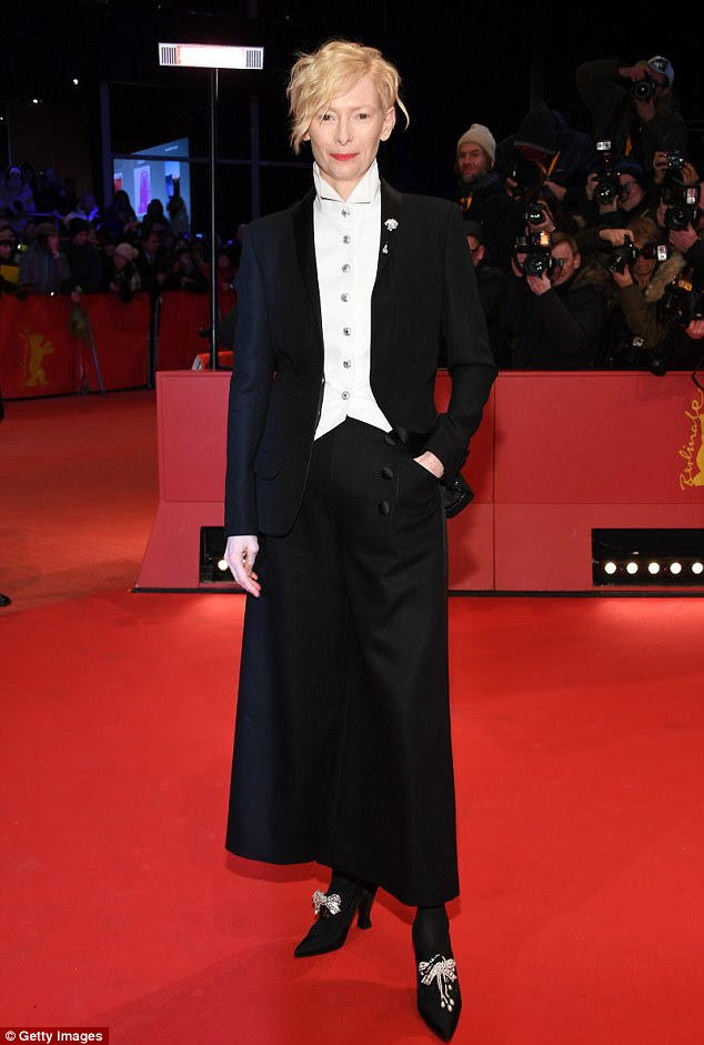 She's out of this world: Tilda Swinton, 57, showed off her trademark androgynous style in a quirky trouser suit and heels as she promoted Isle of Dogs at Berlin film festival on Thursday
