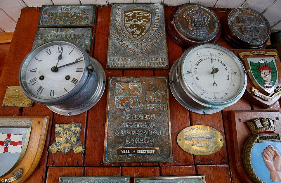 In memory: Plaques on board one of the ships display the dates of previous anniversary gatherings, held in 1990 and 1965, among others