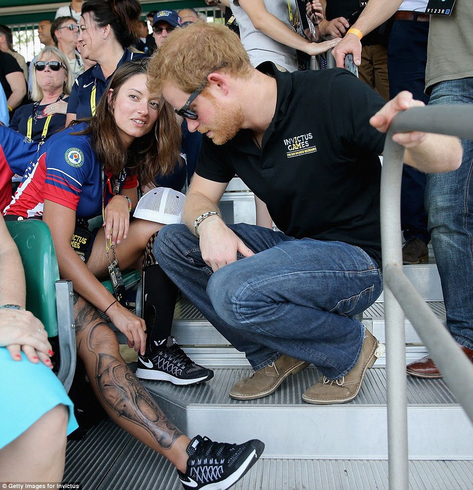 Elizabeth Marks from the US team appears to capture the prince's attention with her impressive leg tattoos
