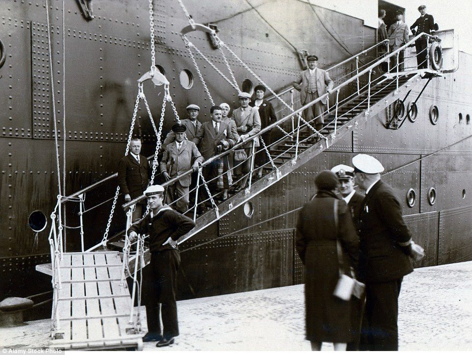 Passengers walk the gangway of the German ship, Monte Rosa, as they head for a voyage at sea in 1931