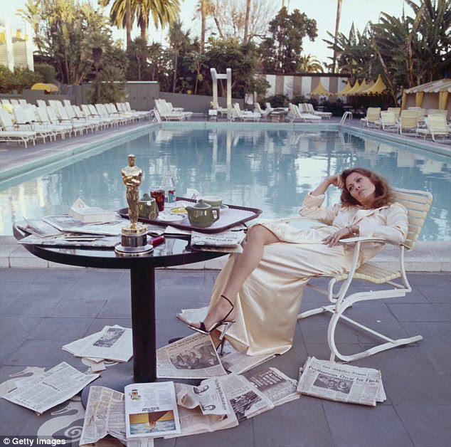 Oscar winner: Faye Dunaway takes in her Oscar win over breakfast and papers at the Beverley Hills Hotel in 1977
