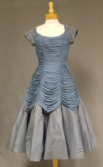 http://www.pinterest.com/pin/109986415871463506/ Slate gathered jersey and taffeta 1950's cocktail dress. http://www.vintageous.com/