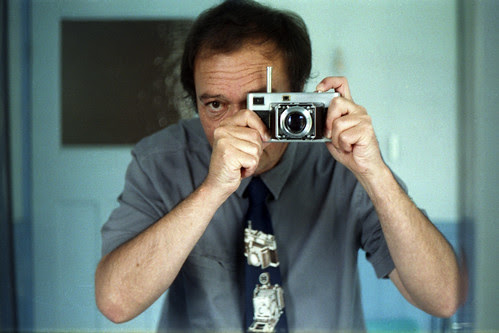 reflected self-portrait with Voigtlander Vitessa and matching tie by pho-Tony