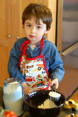 Will baking cookies in his new digger apron by Eve Fox, Garden of Eating blog, copyright 2012