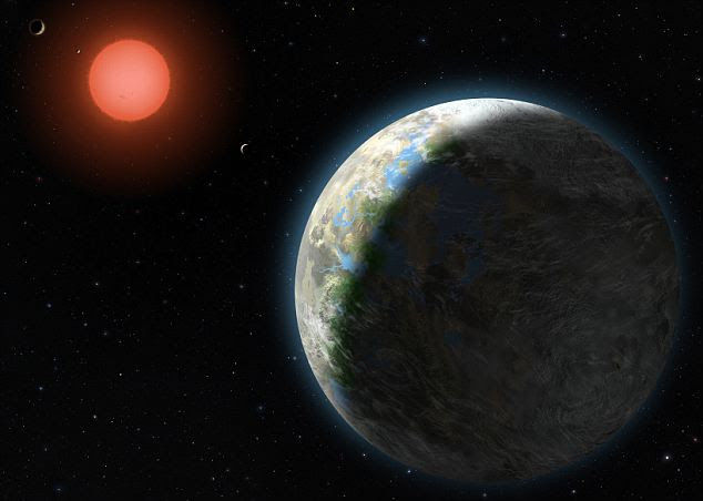 This artist's conception shows the inner four planets of the Gliese 581 system and their host star, a red dwarf star only 20 light years away from Earth