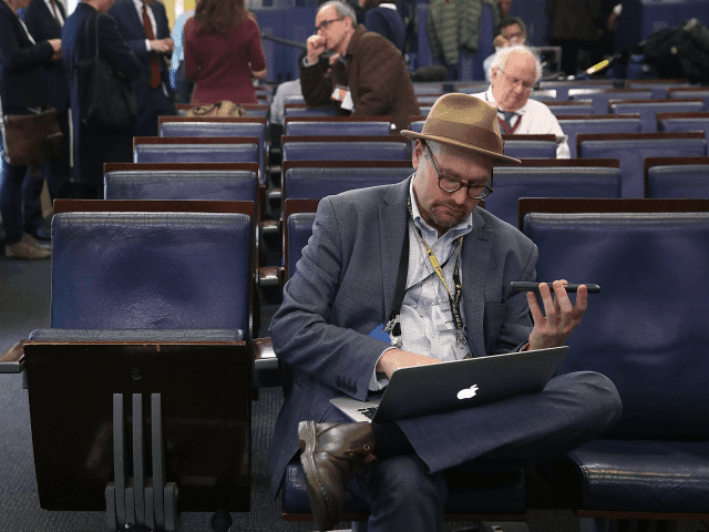 WASHINGTON, DC - FEBRUARY 24: New York Times reporter Glenn Thrush works in the Brady Briefing Room after being excluded from a press gaggle by White House Press Secretary Sean Spicer, on February 24, 2017 in Washington, DC. The New York Times, Los Angeles Times, CNN and Politico were also excluded from the off camera gaggle. (Photo by Mark Wilson/Getty Images)
