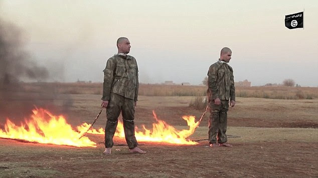 Standing barefoot in the middle of a desert, they are connected by the neck to a torched fuse which eventually engulfs their bodies in flames