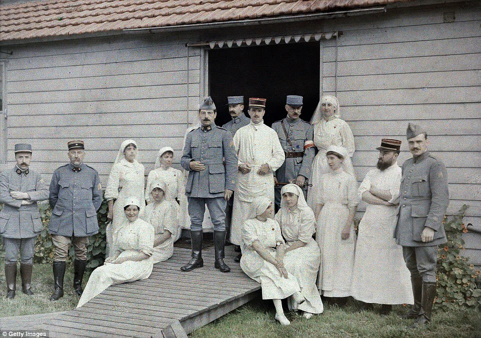 Uniformed doctors and nurses stand in front of field hospital 55 in Bourbourg, northern France on 1 September 1917