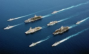 A rare occurrence of a 5-country multinational fleet, during Operation Enduring Freedom in the Oman Sea. In four descending columns, from left to right: MM Maestrale (F 570), De Grasse (D 612); USS John C. Stennis (CVN 74), Charles De Gaulle (R 91), Surcouf (F 711); USS Port Royal (CG-73), HMS Ocean (L 12), USS John F. Kennedy (CV 67), HNLMS Van Amstel (F 831); and ITS Luigi Durand de la Penne (D 560).