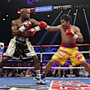 FILE - In this May 2, 2015, file photo, Manny Pacquiao, right, from the Philippines, trades blows with Floyd Mayweather Jr., during their welterweight title fight in Las Vegas. Casinos will find out how much of a boon the Mayweather -Pacquiao fight was for Las Vegas' bottom line when the state releases its monthly data, Friday, June 26, 2015. (AP Photo/John Locher, File)