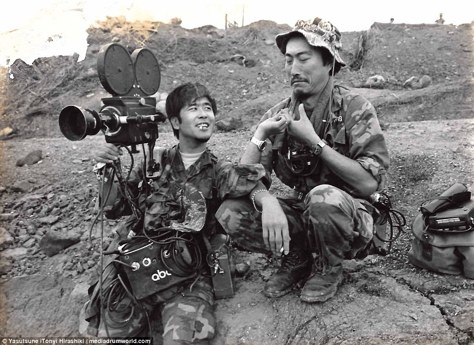 Yasutsune 'Tony' Hirashiki is pictured at left chatting with an NBC cameraman. Hirashiki was working as a cameraman for ABC during the Vietnam War