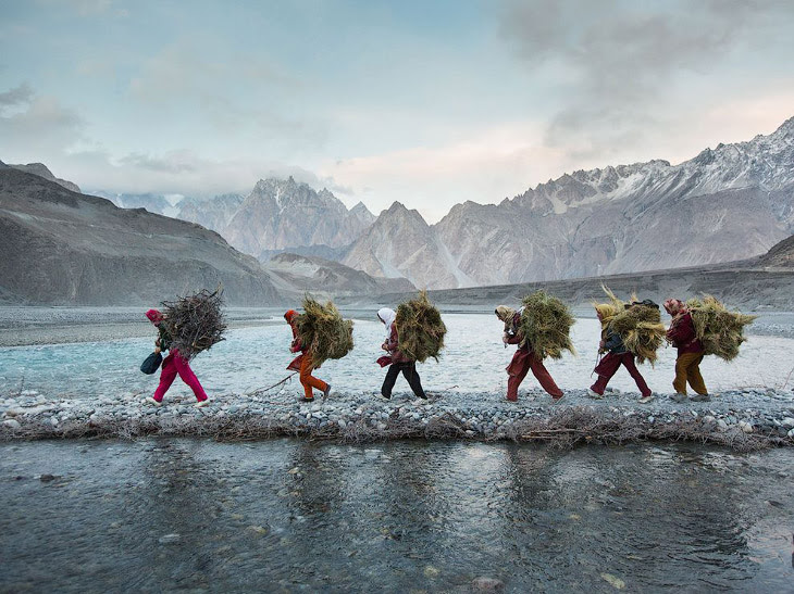 Women returning home with firewood and fodder, Pakistan